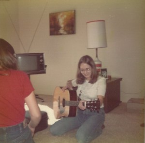 This is the guitar I got in December of the year referenced in this story. It lived under a bed in Phoenix, Arizona, and I bought it for $300 with confirmation gift and saved babysitting money. This picture was taken just after I got it. You can see it was a pretty joyful moment. 